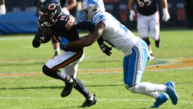 Darnell Mooney hauls in a Justin Fields pass against the Lions.